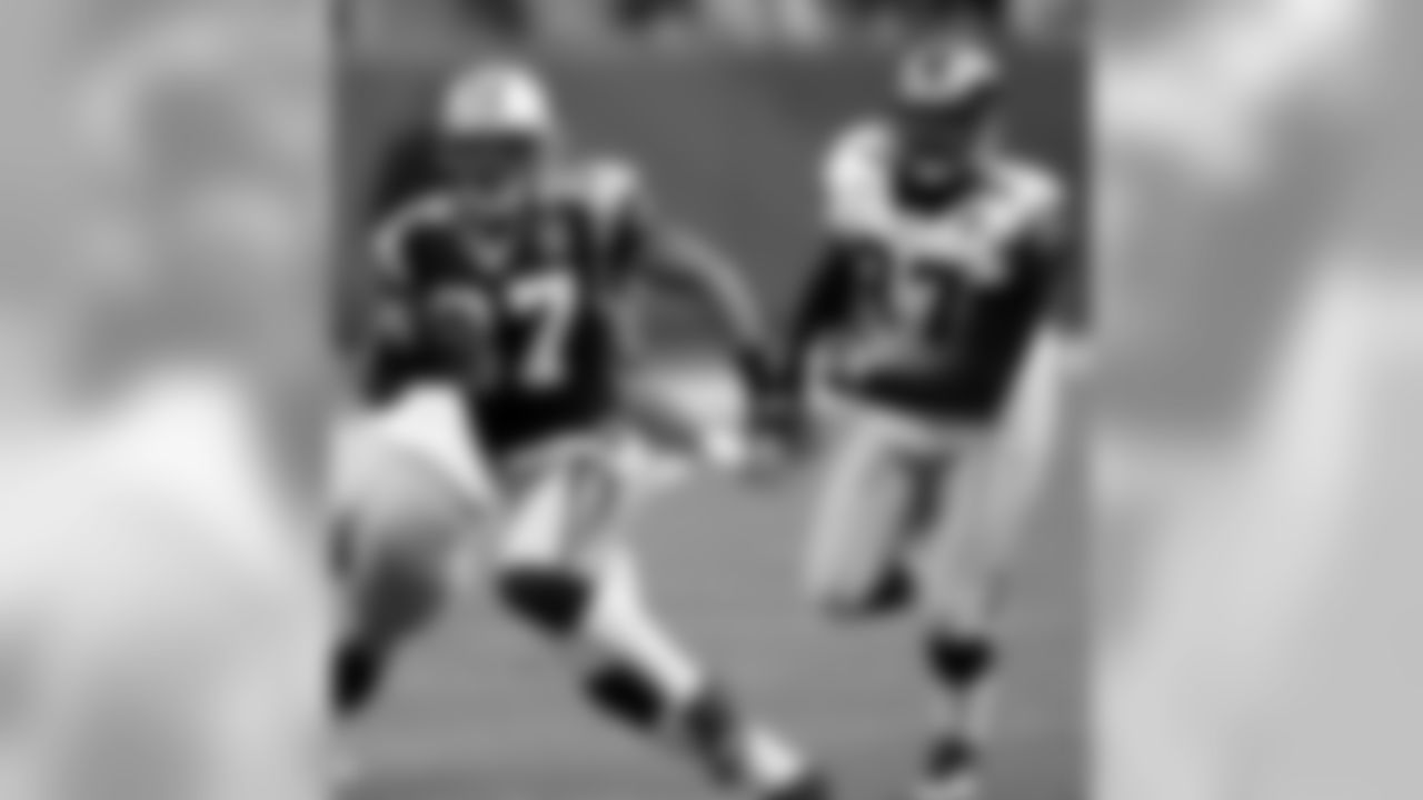 Carolina Panthers' Nick Goings (37) runs past St. Louis Rams' Typka jackson (97) during the second quarter of the Panthers' 20-7 win in Charlotte, N.C., Sunday, Dec. 12, 2004. Goings, Carolina's sixth-string running back when the season started, ran for 108 yards and one touchdown.(AP Photo/Chuck Burton)