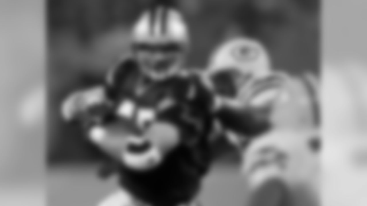 Carolina Panthers' Brad Hoover (45) breaks the tackle of Green Bay Packers' Bernardo Harris (55) in the second quarter at Ericsson Stadium in Charlotte, N.C., Monday Nov. 27, 2000. (AP Photo/Chuck Burton)