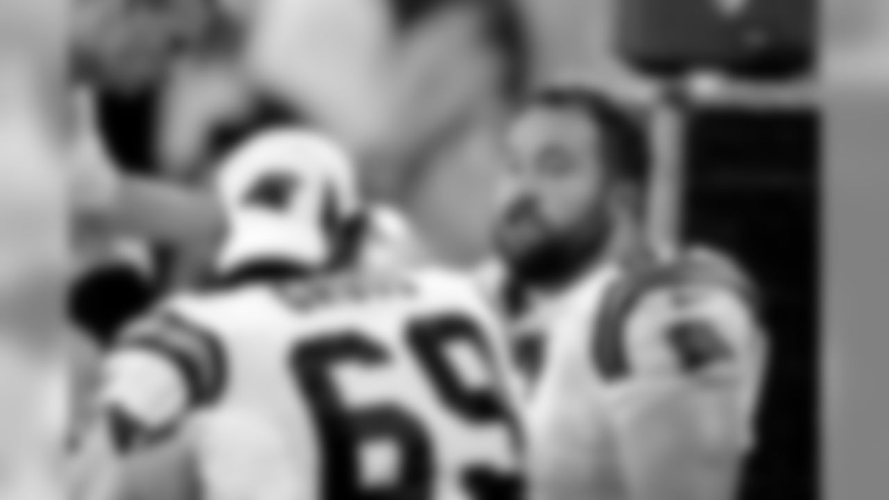Carolina Panthers center Ryan Kalil (67) talks with Carolina Panthers tackle Jordan Gross (69) during a preseason NFL football game against the Chicago Bears in Charlotte, N.C., Friday, Aug. 9, 2013. (AP Photo/Mike McCarn)
