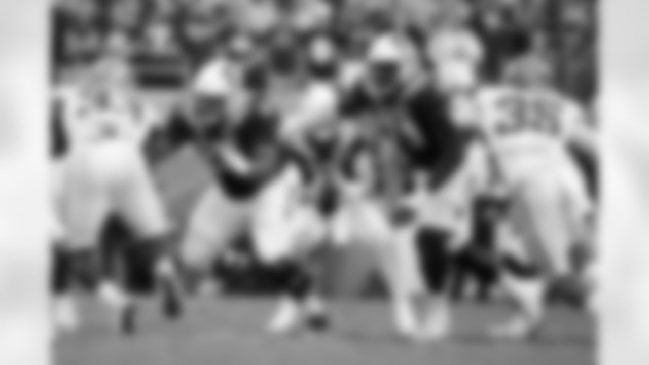North Carolina State's Chandler Zavala (64) and Ikem Ekwonu (79) guard the line against Clemson's Ruke Orhorhoro (33) and Clemson's Justin Foster (35) during the second half of an NCAA college football game in Raleigh, N.C., Saturday, Sept. 25, 2021. (AP Photo/Karl B DeBlaker)