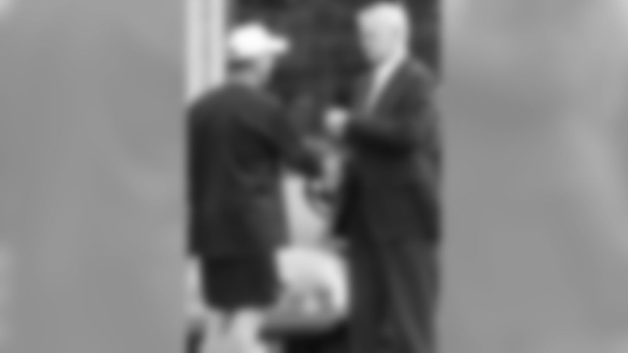 Quarterbacks coach Rip Scherer meets Richardson.