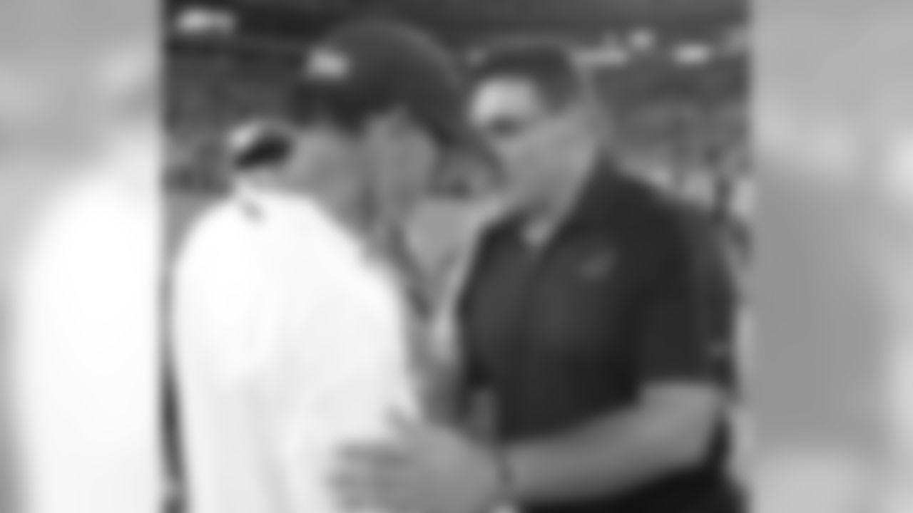 Carolina Panthers head coach Ron Rivera, right, greets Chicago Bears head coach Marc Trestman, left, after a preseason NFL football game in Charlotte, N.C., Friday, Aug. 9, 2013. The Panthers won 24-17. (AP Photo/Bob Leverone)