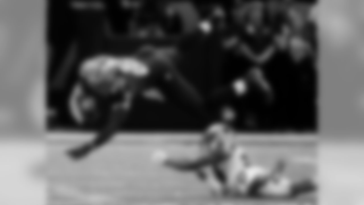 New Orleans Saints tight end Jimmy Graham (80) is upended by Carolina Panthers cornerback Josh Norman on a reception in the first half of an NFL football game in New Orleans, Sunday, Dec. 7, 2014. (AP Photo/Bill Haber)