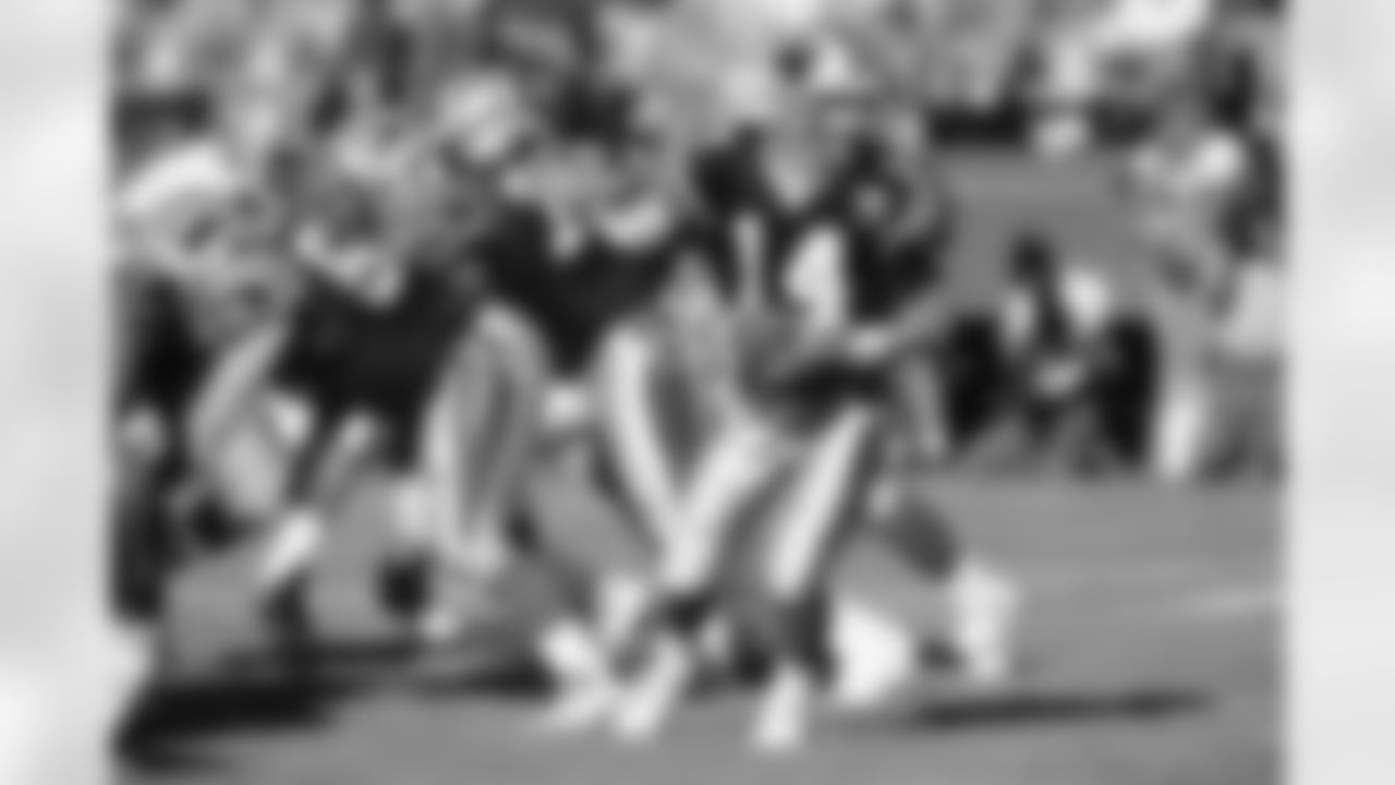 SAN FRANCISCO, CA - AUGUST 19: Quarterback Frank Reich #14 of the Carolina Panthers takes the snap during the exhibition game against the San Francisco 49ers at Candlestick Park on August 19, 1995 in San Francisco, California. The 49ers won 17-10. (Photo by George Rose/Getty Images)