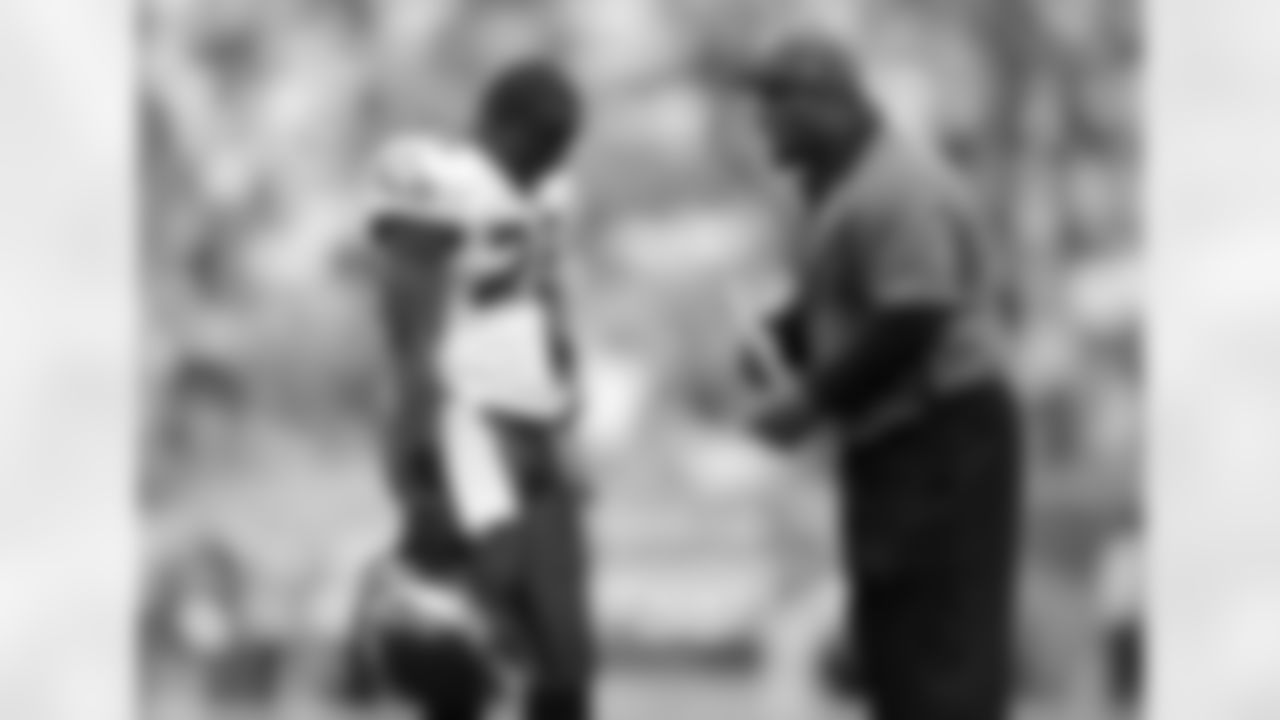 Philadelphia Eagles special team quality control coach Duce Staley, right, talks to running back LeSean McCoy (25) in the second half of an NFL football game, Sunday, Sept. 16, 2012, in Philadelphia. Philadelphia won 24-23. (AP Photo/Michael Perez)
