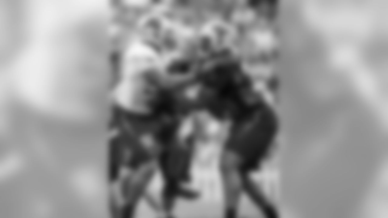 DE Frank Alexander and T Michael Oher