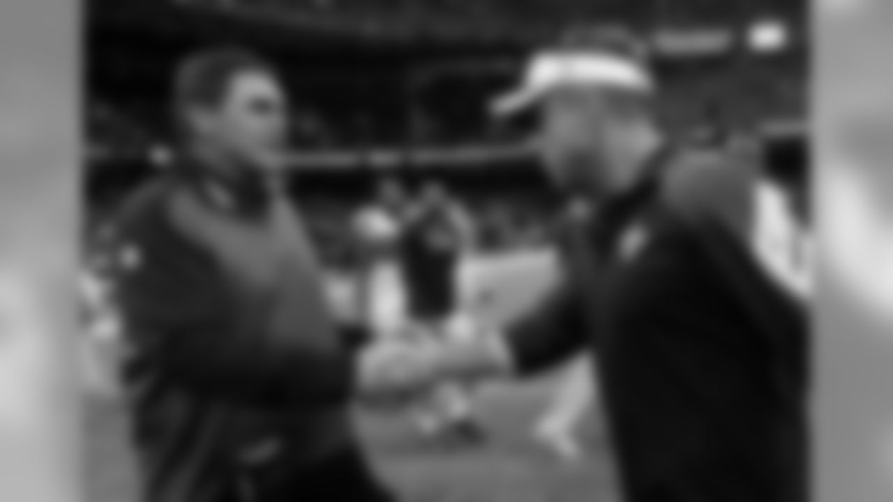 Carolina Panthers head coach Ron Rivera, left, shakes hands with New Orleans Saints head coach Sean Payton, right, after their NFL football game in New Orleans, Sunday, Dec. 7, 2014. The Panthers won 41-10. (AP Photo/Bill Feig)