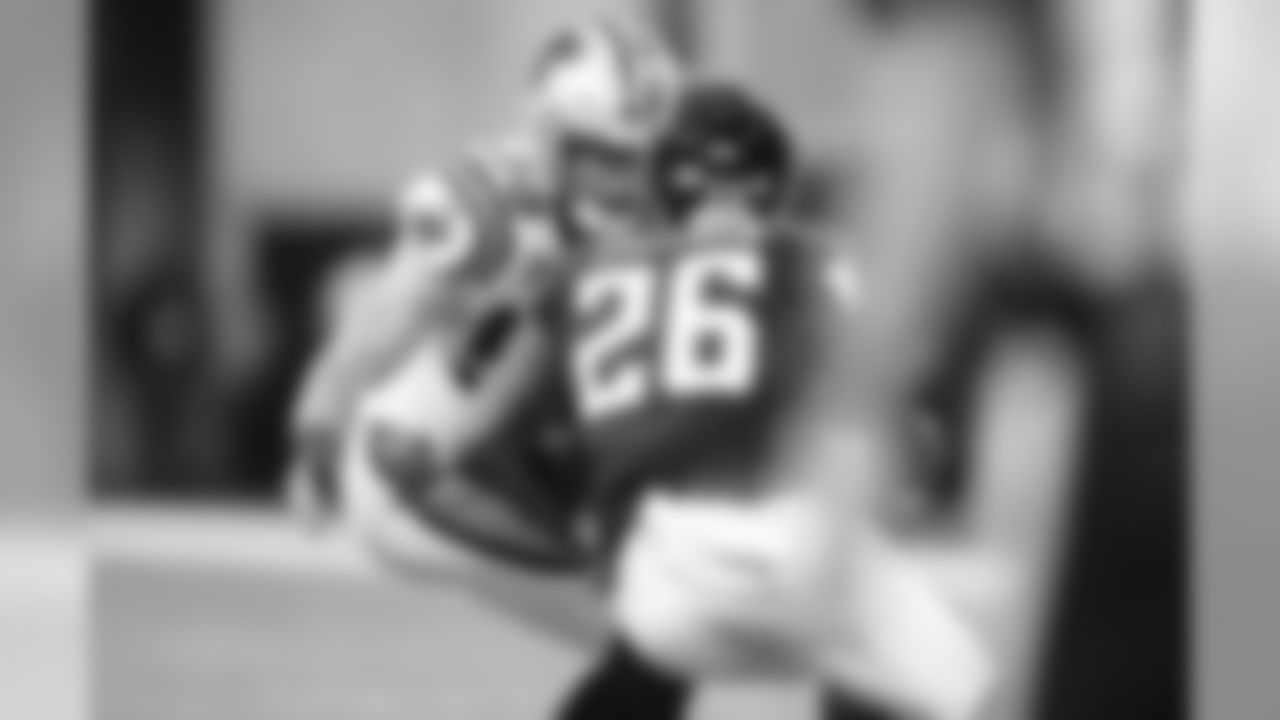 Luke Kuechly prepares to tackle Tevin Coleman during a game against the Atlanta Falcons at Mercedes-Benz Stadium on Sunday, September 16, 2018.