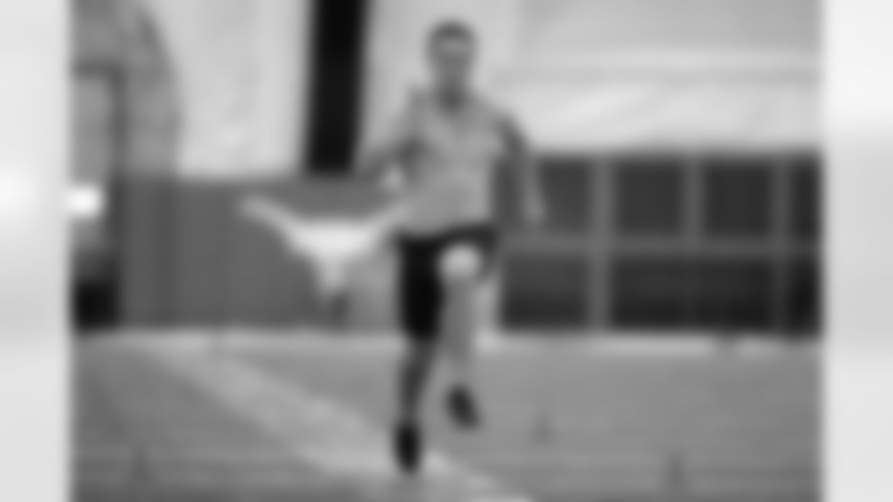 Texas quarterback Sam Ehlinger runs the 40-yard dash at the school's pro football day Thursday, March 11, 2021, in Austin, Texas. (AP Photo/Eric Gay)