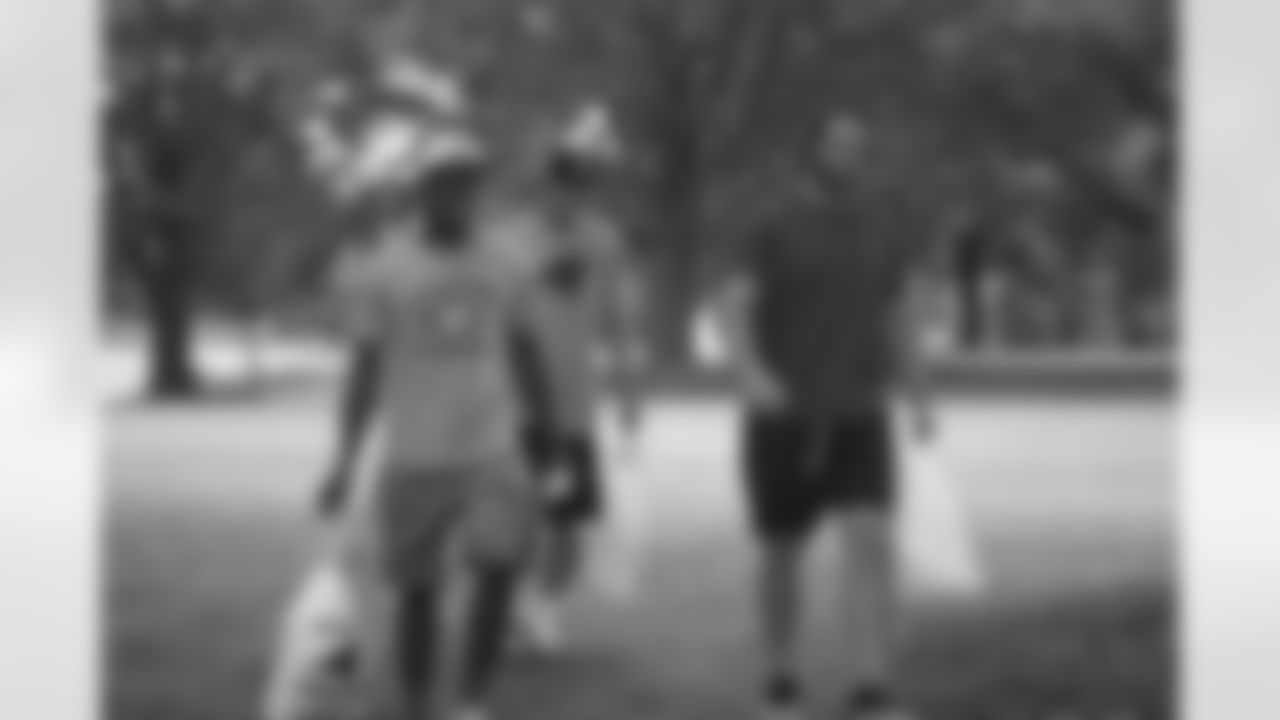 WR Taulib Ikharo, QB Colby Cameron, FB Michael Zordich