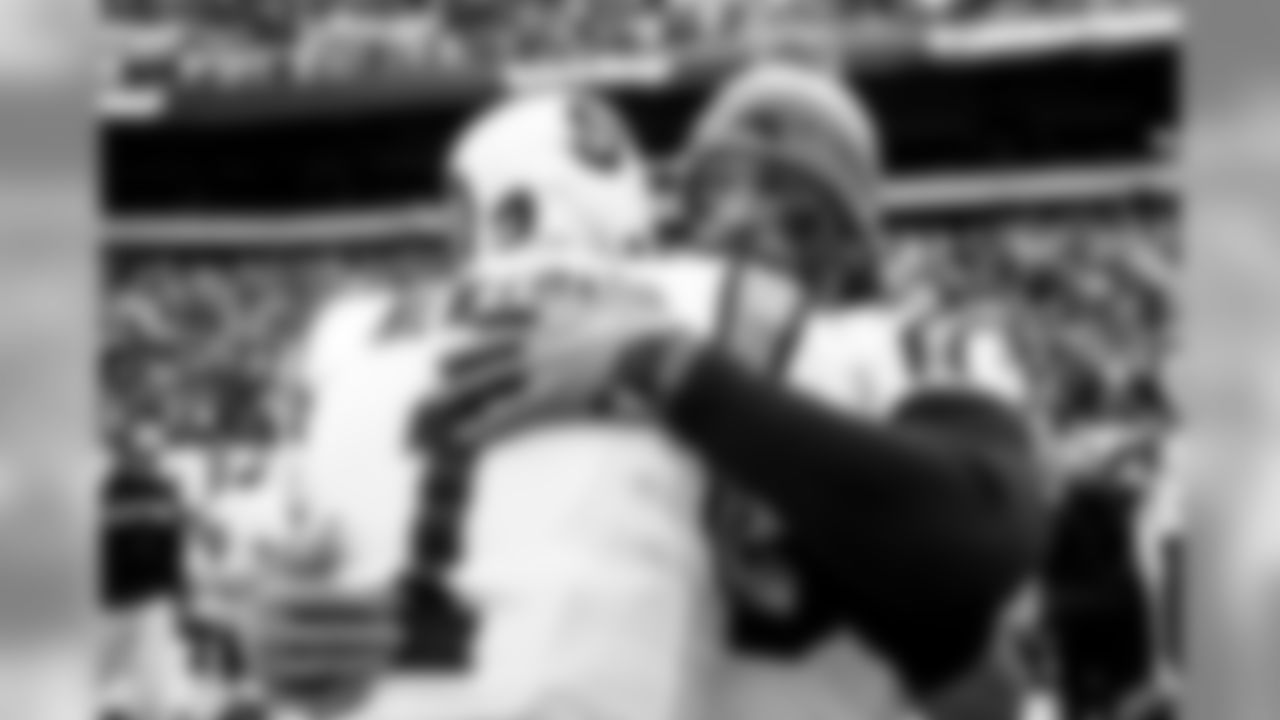 Cam Newton hugs Julius Peppers during a game against the Philadelphia Eagles at Lincoln Financial Field on Sunday, October 21, 2018.