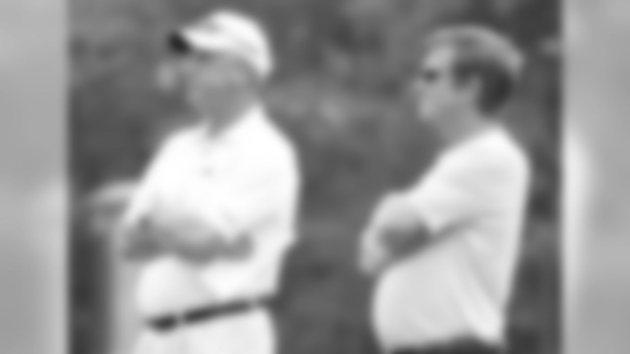 The brain trust watches practice on June 4, 2009.