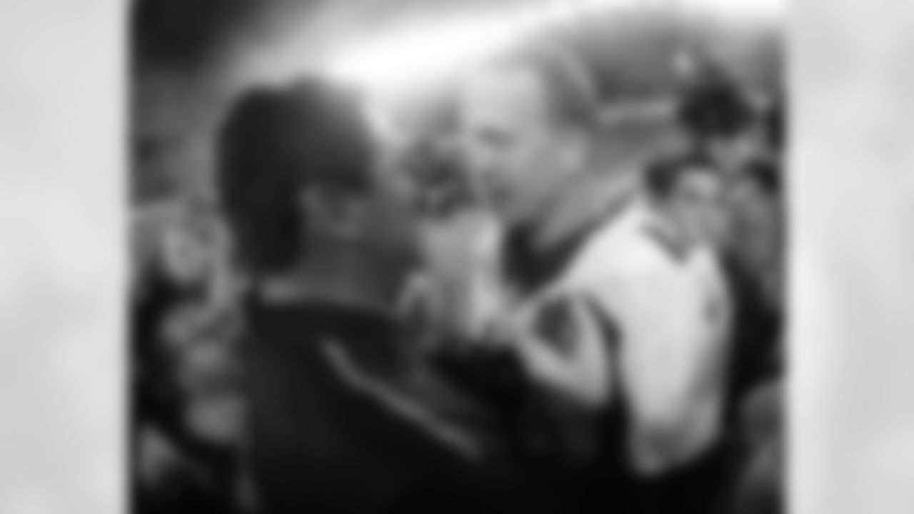 Denver Broncosâ Peyton Manning, right, and Carolina Panthersâ head coach Ron Rivera meet after the NFL Super Bowl 50 football game Sunday, Feb. 7, 2016, in Santa Clara, Calif. The Broncos won 24-10. (AP Photo/Julio Cortez)