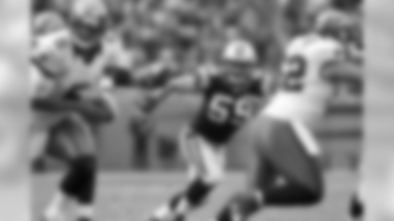 Kuechly tracks the ball as Buccaneers quarterback Josh Freeman looks to hand off.