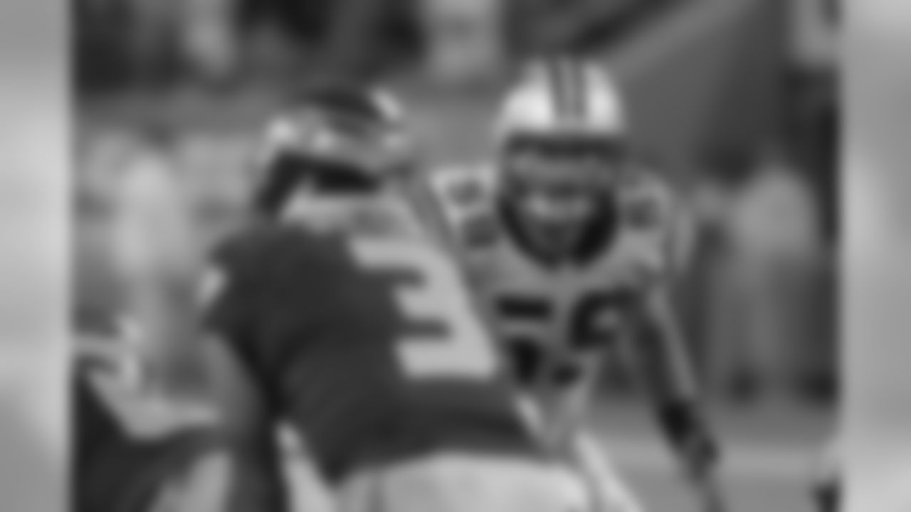 Kuechly stares down Seahawks quarterback Russell Wilson.