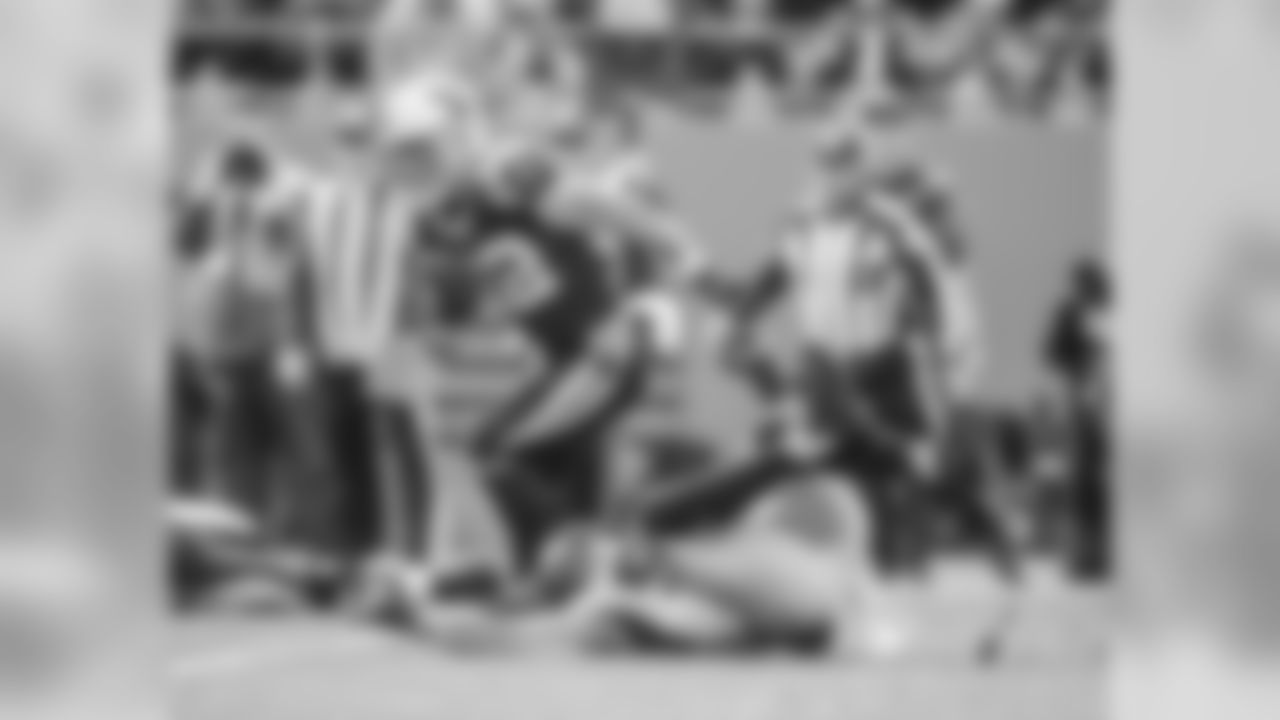 Christian McCaffrey breaks a tackle against the Atlanta Falcons at Bank of America Stadium on Sunday, December 23, 2018.