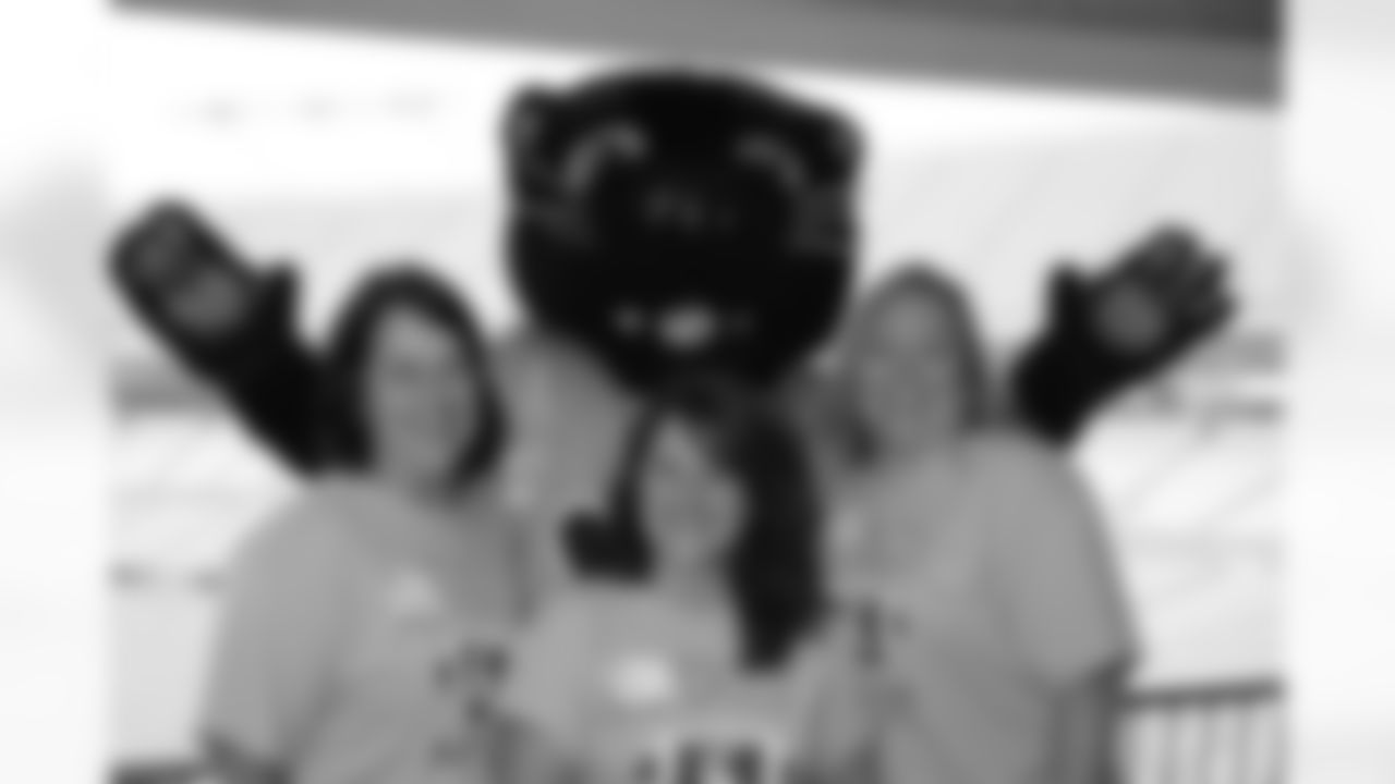 Independence High School Moms took a break with Sir Purr on the terrace prior to the start of the event.