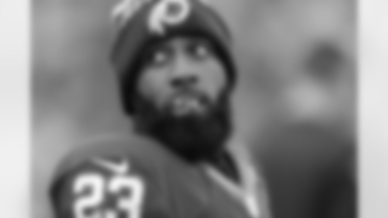 Washington Redskins cornerback DeAngelo Hall (23) looks over his shoulder as he crews on his mouth guard during the second half of an NFL football game against the Buffalo Bills in Landover, Md., Sunday, Dec. 20, 2015. (AP Photo/Mark Tenally)