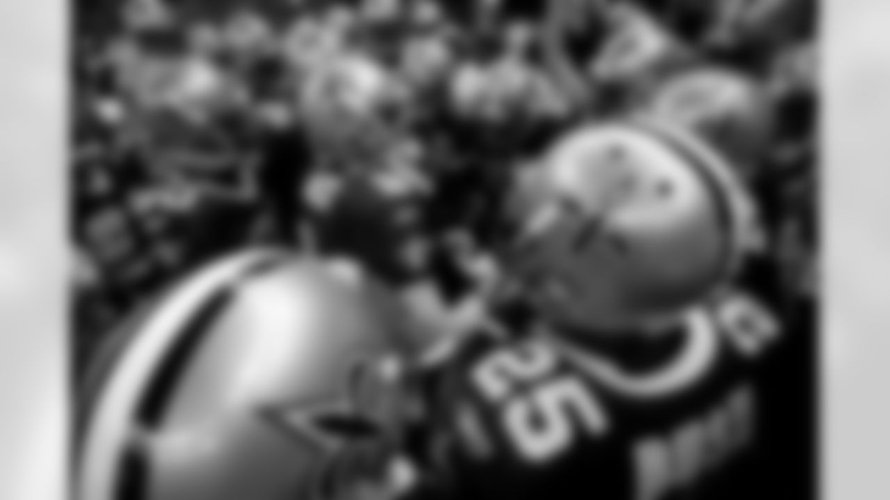 New Orleans Saints quarterback Drew Brees (9) leads his team in a pregame cheer before their NFL football game against the Carolina Panthers in New Orleans, Sunday, Nov. 8, 2009. (AP Photo/Dave Martin)