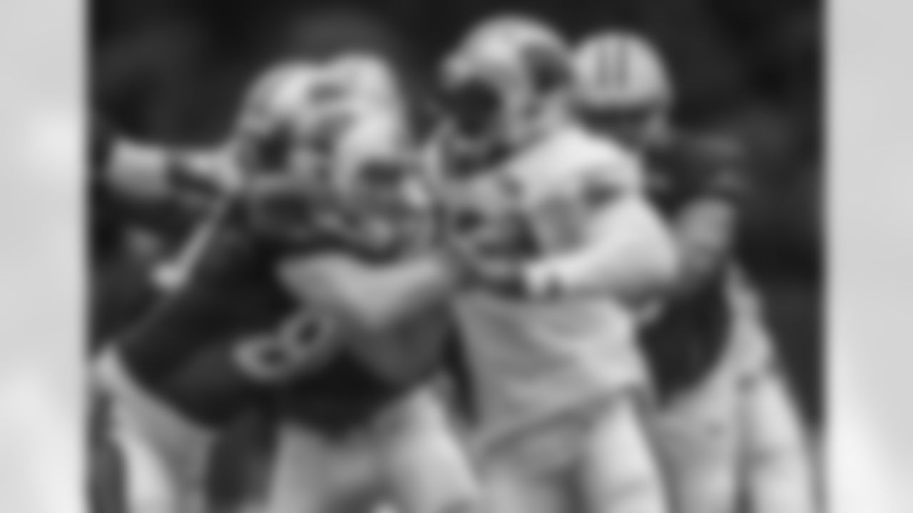 TE Scott Simonson and DE Mario Addison