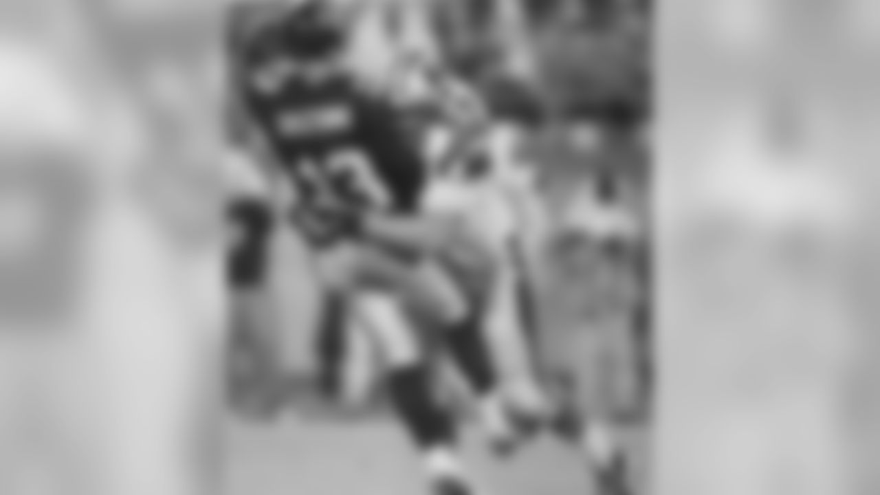 Carolina Panthers' Les Miller (69) sacks Atlanta Falcons quarterback Tony Graziani (13) in the second quarter of their NFL game at Ericsson Stadium in Charlotte, N.C., Sunday Oct. 26, 1997. (AP Photo/Chuck Burton)