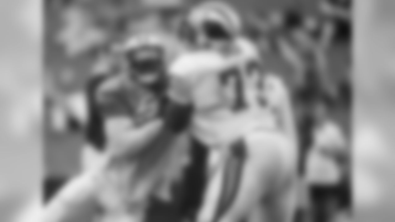 DE Mario Addison and T Michael Oher