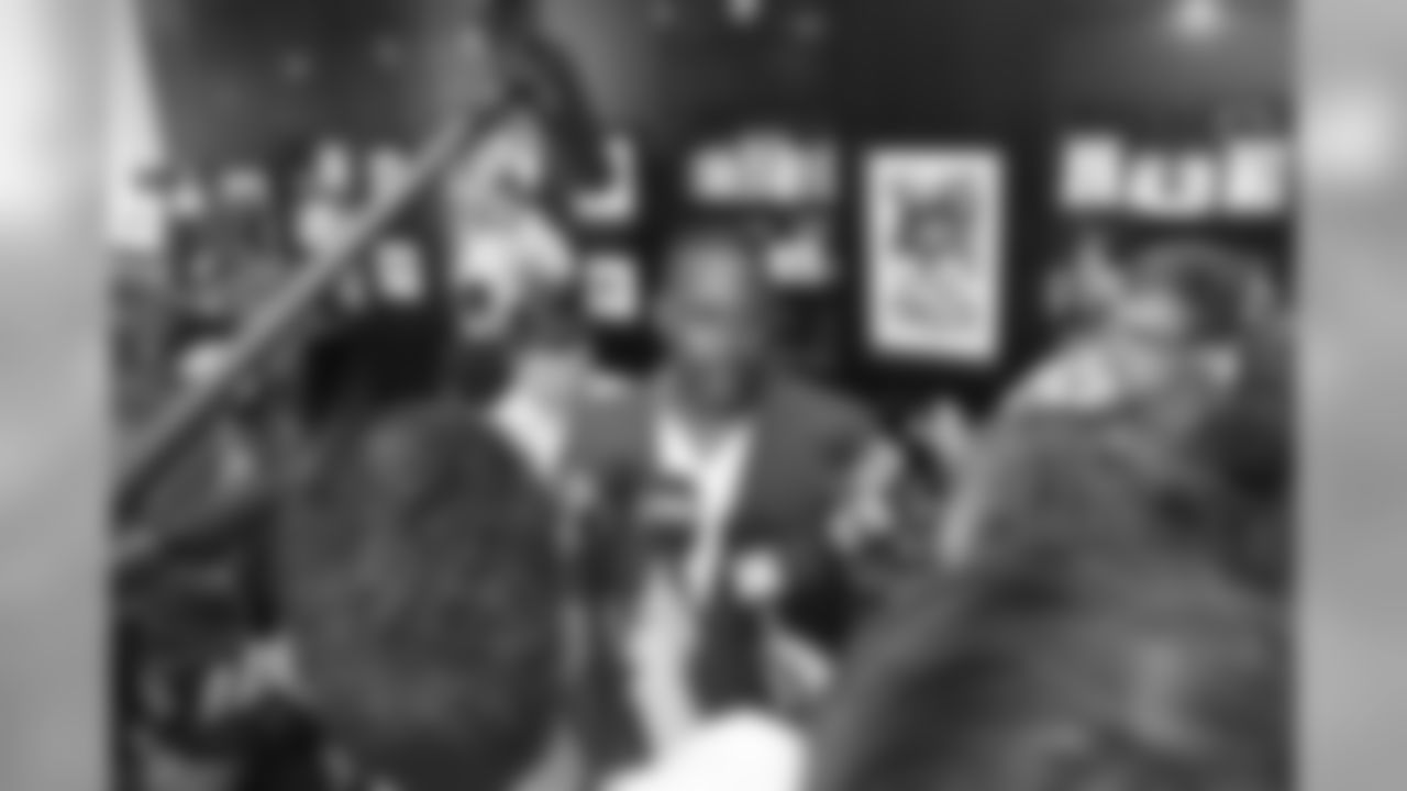 Ty Law talks with the media