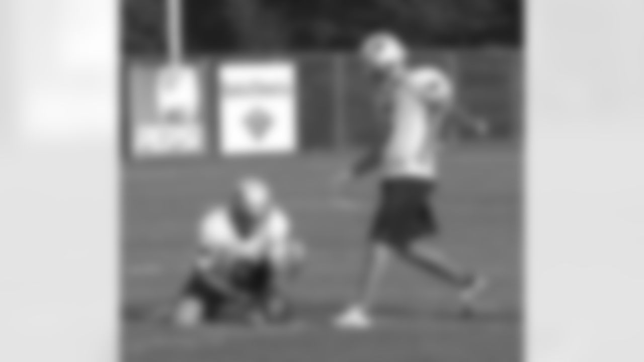 Rookie Kicker Stephen Gostkowski (3) kicks the ball while Josh Miller(8) holds it in place during the evening practice of Day 2 of Training Camp. Photo by Elizabeth Propper
