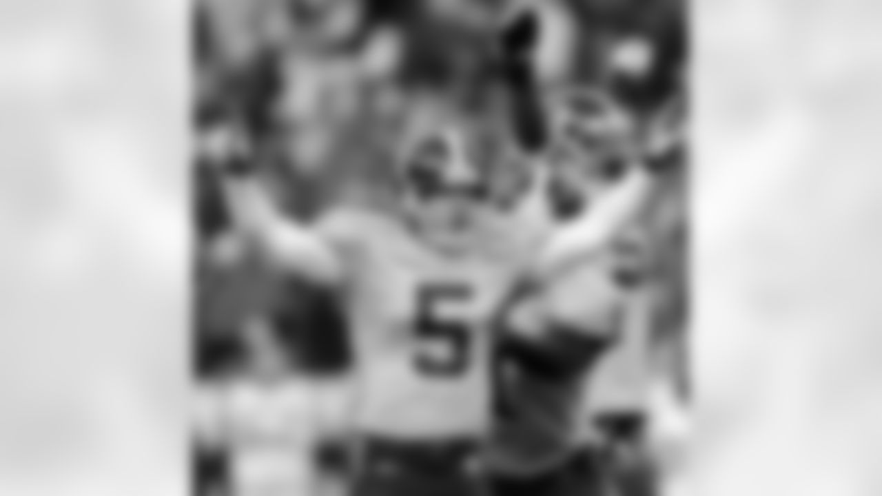 Denver Broncos' Matt Prater (5) celebrates with teammates after kicking a 41-yard field goal in overtime to defeat the New England Patriots 20-17 in an NFL football game Sunday, Oct. 11, 2009, in Denver. (AP Photo/Chris Schneider)
