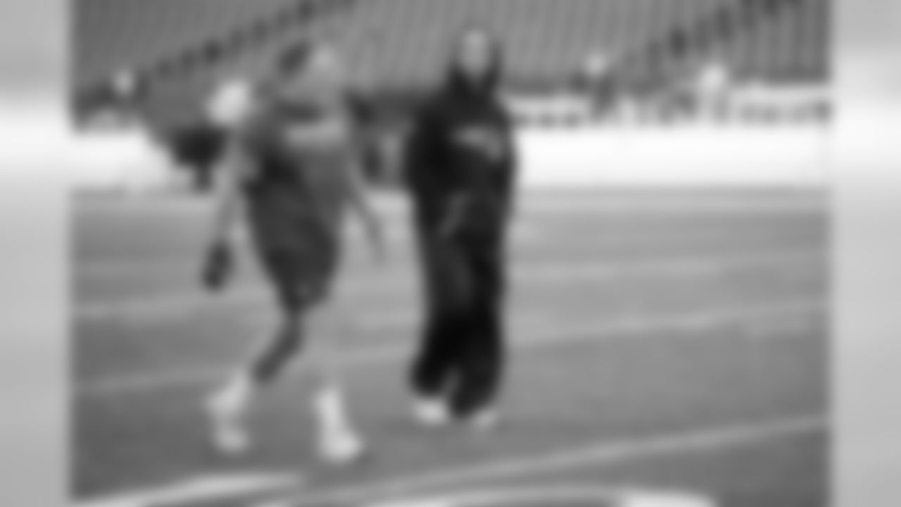 New England Patriots head coach Bill Belichick and head strength and conditioning coach Moses Cabrera walk the field prior to the NFL post season AFC Divisional playoff football game against the Tennessee Titans on Saturday, Jan.13, 2018 in Foxboro, Mass. (Jim Mahoney via AP)