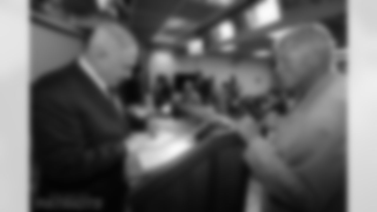 Israel Prime Minister Benjamin Netanyahu signs a copy of his book "Fighting Terrorism" to Ron Yary.