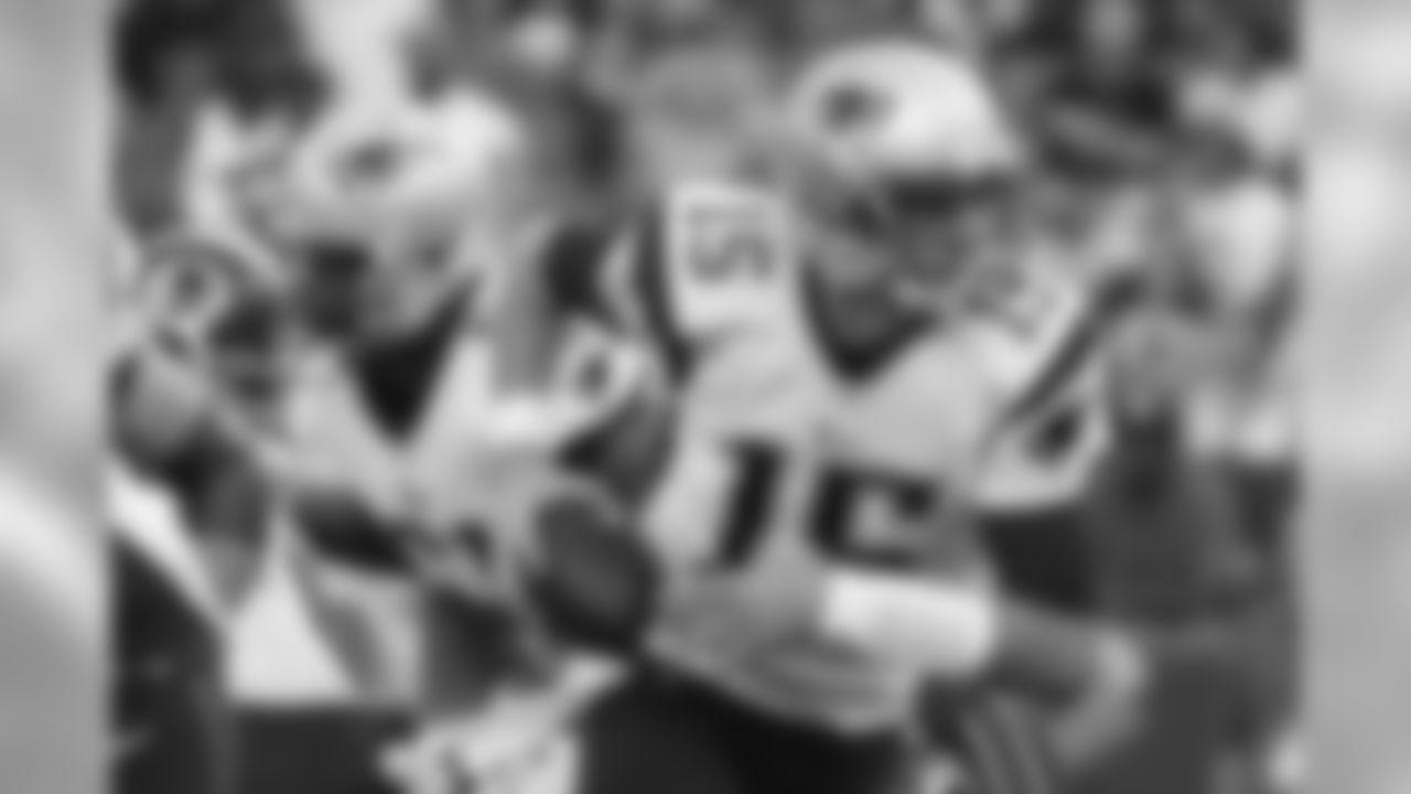 New England Patriots quarterback Ryan Mallett scrambles out of the pocket during the first half of an NFL football preseason game against the Washington Redskins in Landover, Md., Thursday, Aug. 7, 2014. (AP Photo/Alex Brandon)