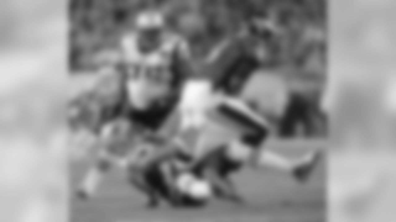LB Rob Ninkovich takes down Vince Young for a sack on Sunday, November 27, 2011.