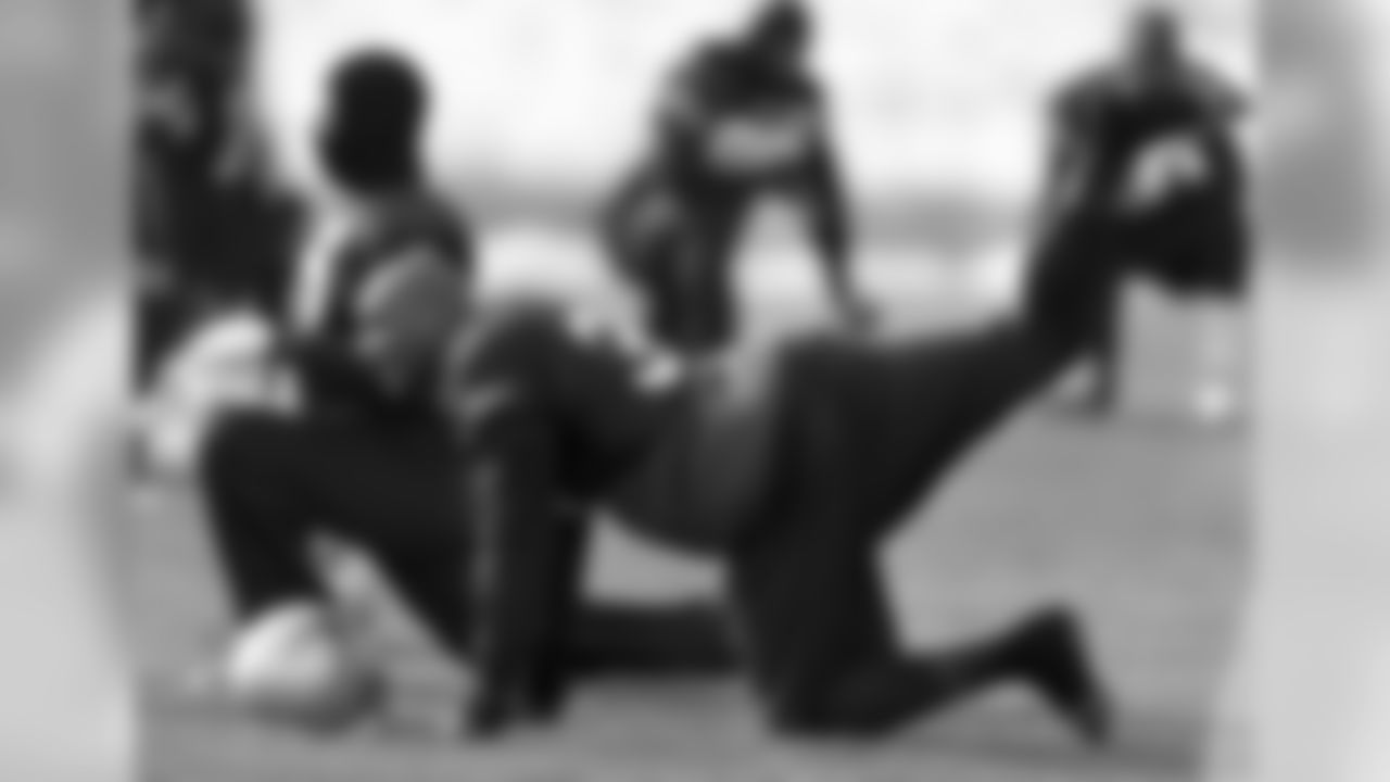 Aqib Talib stretches at team practice on Tuesday