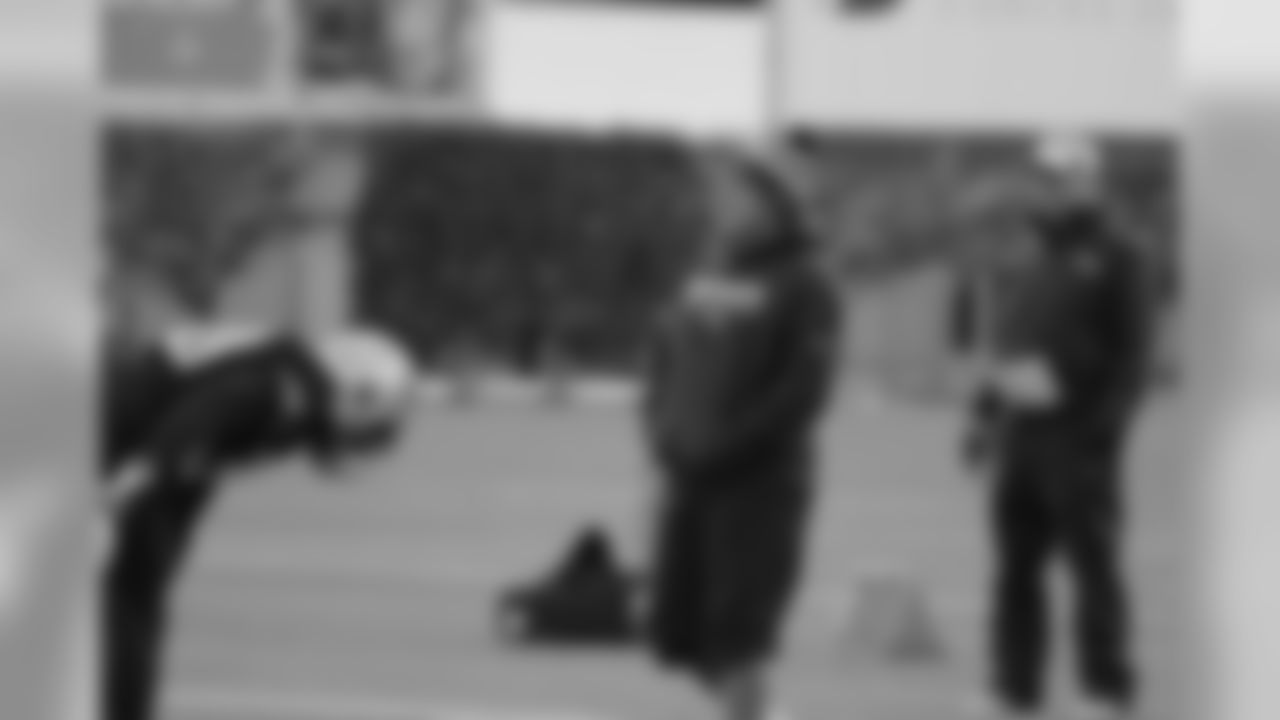 Bill Belichick joking with his players during stretches