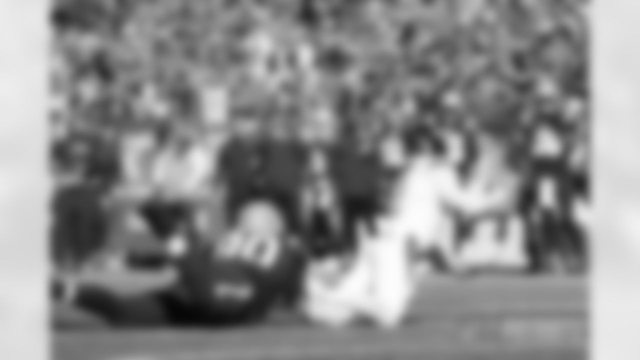 Christian Barmore (90) takes down Zach Wilson (2) for a sack