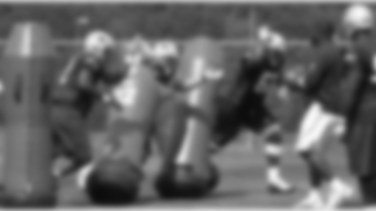 Patriots defense runs drills with defensive Line coach Pepper Johnson during the afternoon practice on Day 4 of Training Camp. 7/31/2006 Photo by Elizabeth Propper
