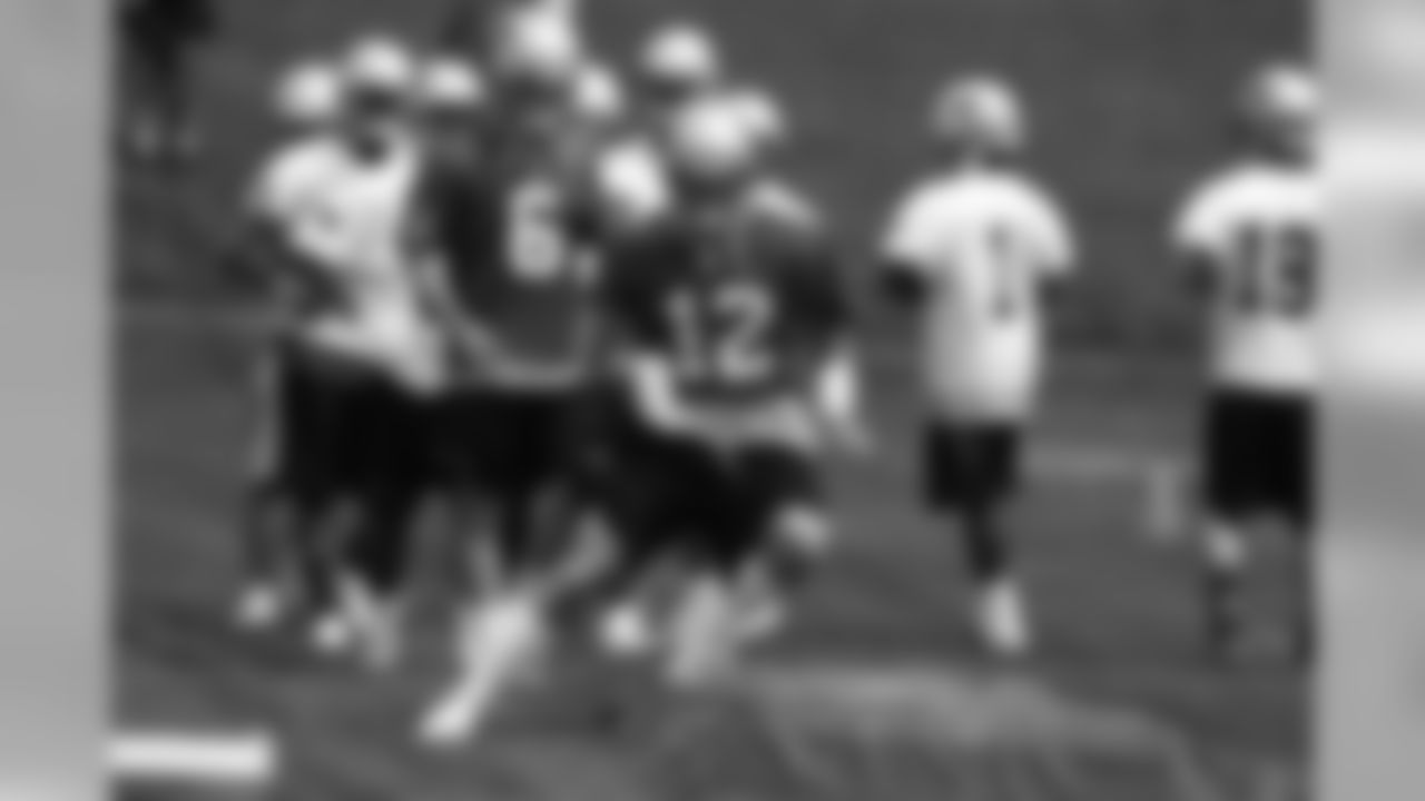 Tom Brady(12) runs through a bag drill on day two of mini camp at Gillette Stadium. 6/14/2006 Photo by David Silverman