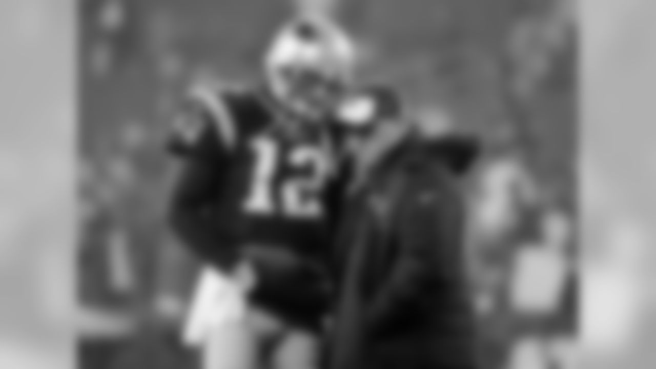 New England Patriots quarterback Tom Brady (12) talks to offensive coordinator Josh McDaniels before the AFC championship NFL football game against the Pittsburgh Steelers, Sunday, Jan. 22, 2017, in Foxborough, Mass. (AP Photo/Elise Amendola)