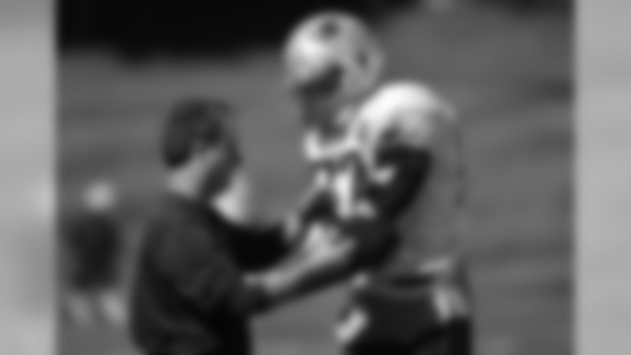 New England Patriots head athletic trainer Jim Whalen, left, attaches an arm brace for tight end Rob Gronkowski, right, during NFL football practice, Wednesday, Sept. 23, 2015, in Foxborough, Mass. (AP Photo/Steven Senne)