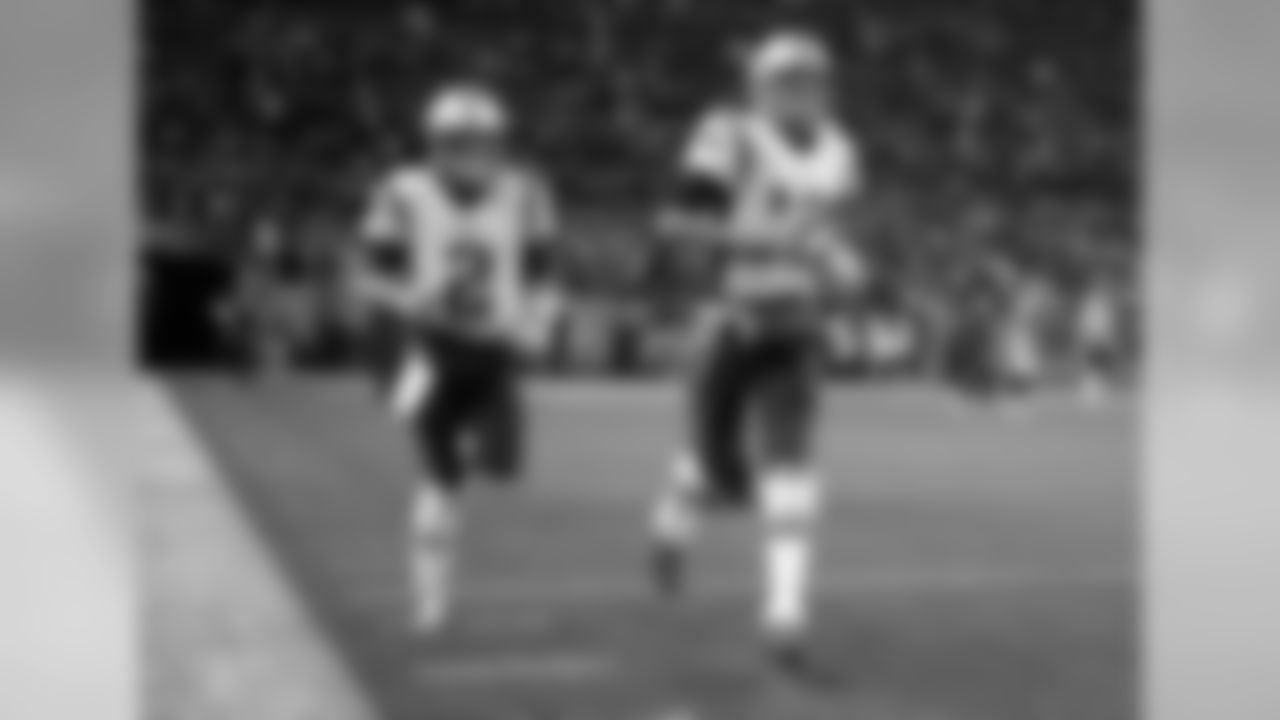 New England Patriots quarterback Tom Brady (12) and quarterback Brian Hoyer (2) take the field prior to an NFL football game against the Denver Broncos, Sunday, Nov. 12, 2017, in Denver. (AP Photo/Jack Dempsey)