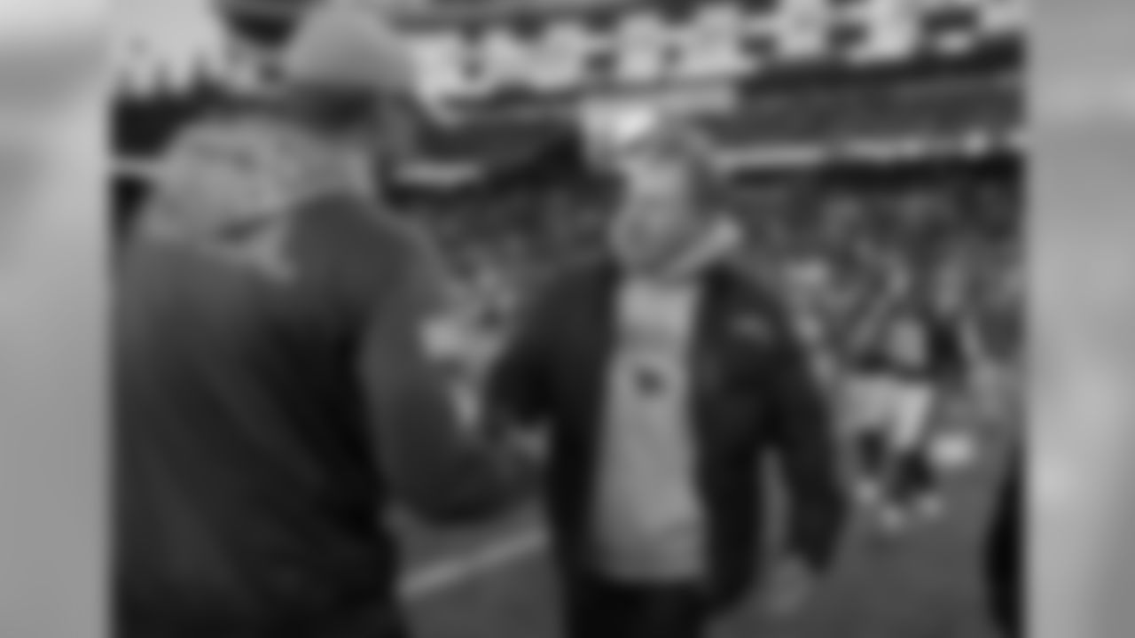 Miami Dolphins head coach Adam Gase, left, and New England Patriots head coach Bill Belichick speak at midfield after an NFL football game, Sunday, Nov. 26, 2017, in Foxborough, Mass. (AP Photo/Michael Dwyer)