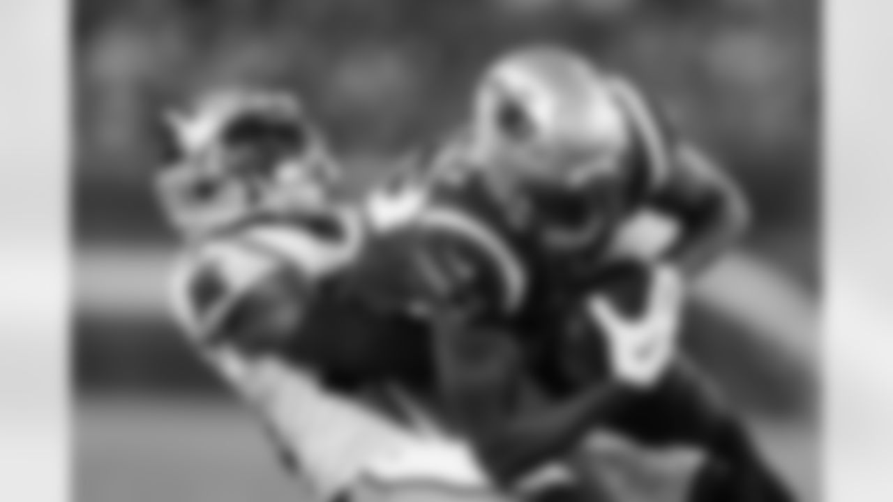 Carolina Panthers safety Sean Chandler, left, tackles New England Patriots wide receiver Lil'Jordan Humphrey