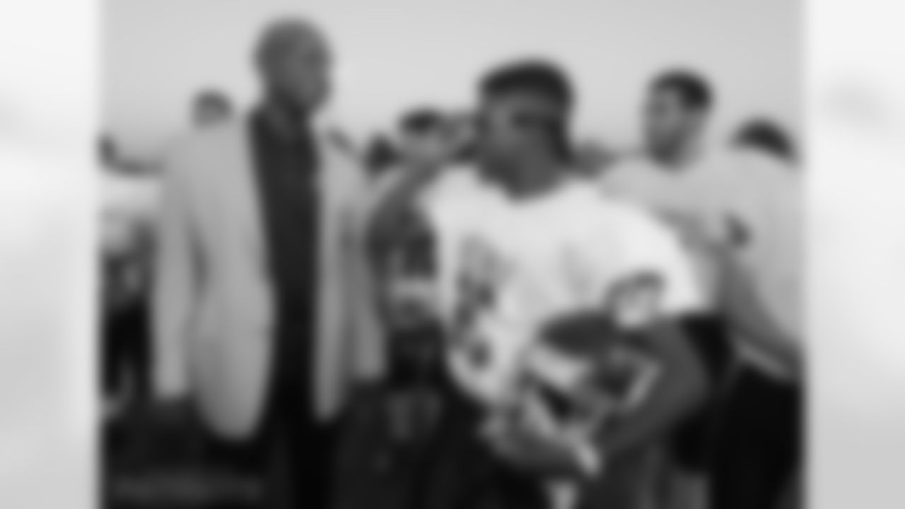 Eric Dickerson, who wore googles during his playing days, meets a bespeckled Israeli Football League player.