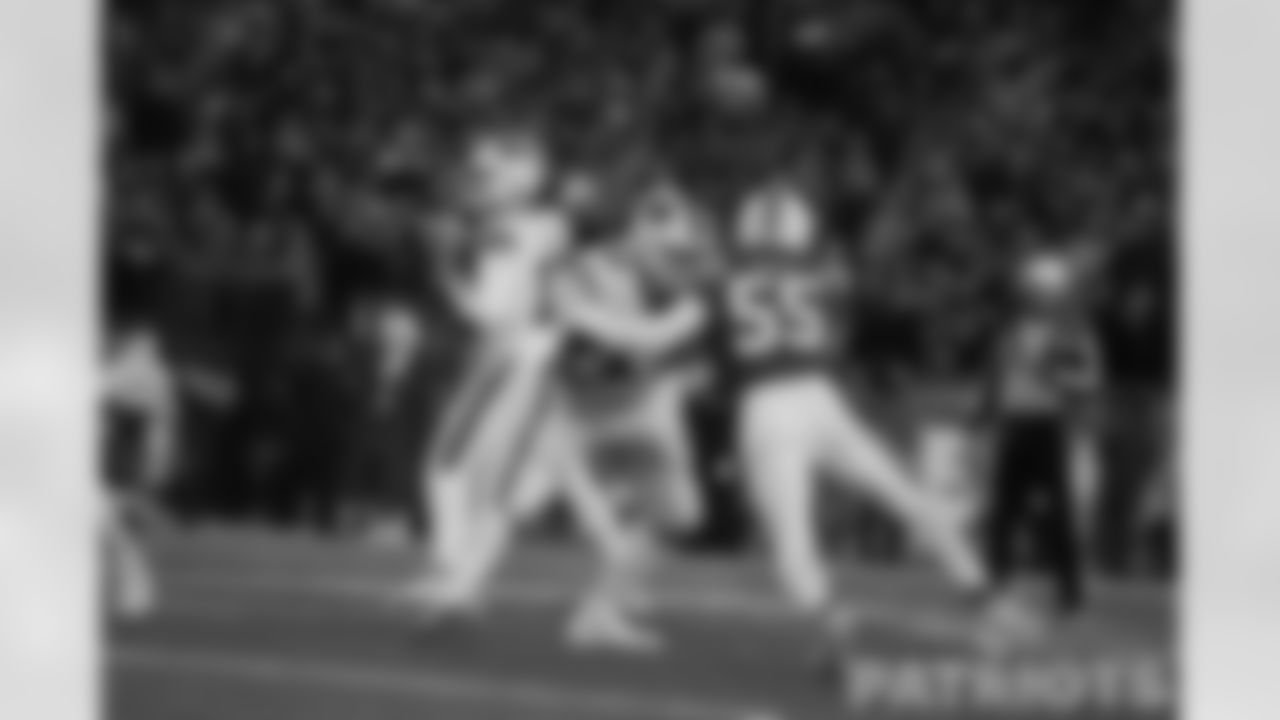 Josh Uche rushes at Bills QB Josh Allen.