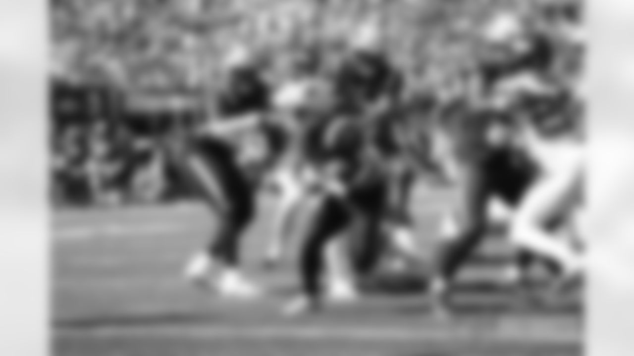 James White (28) fighting to get into the endzone.