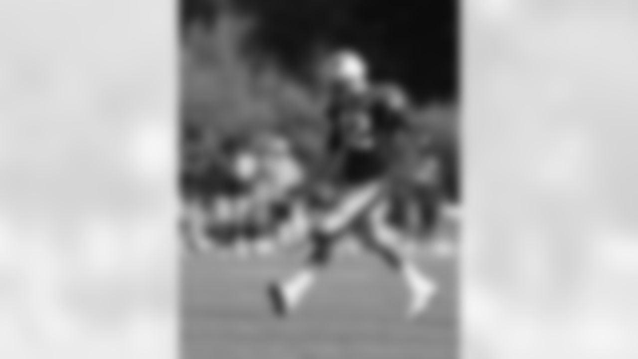 Tom Brady practices punting the ball