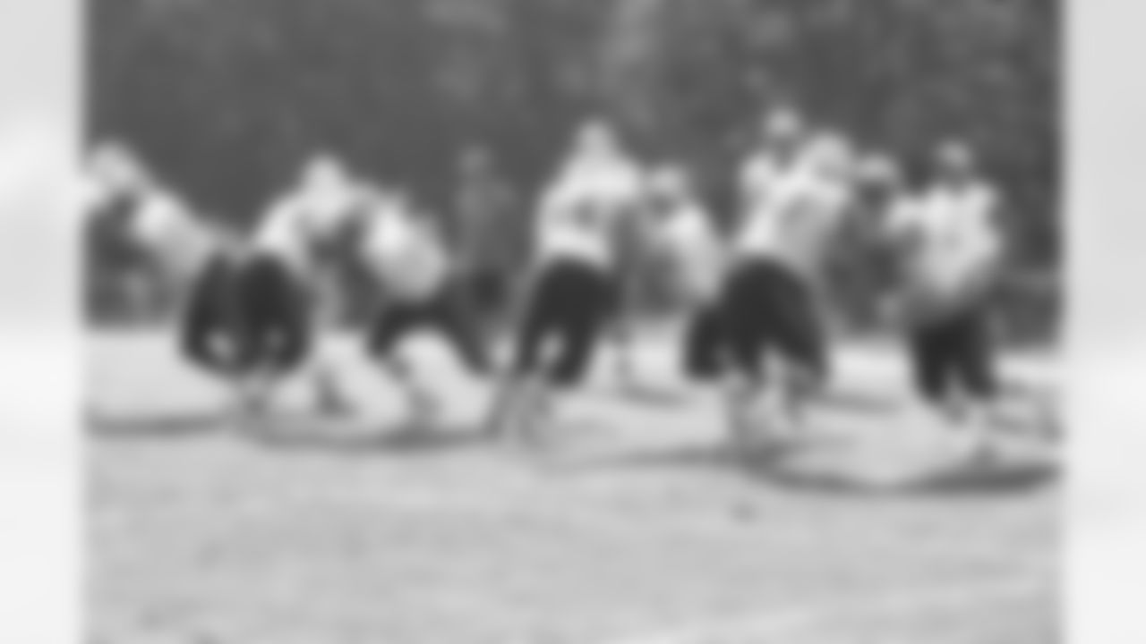 Offensive linemen run drills during the morning session on Day 2 of Training Camp. 7/29/2006 Photo by Elizabeth Propper