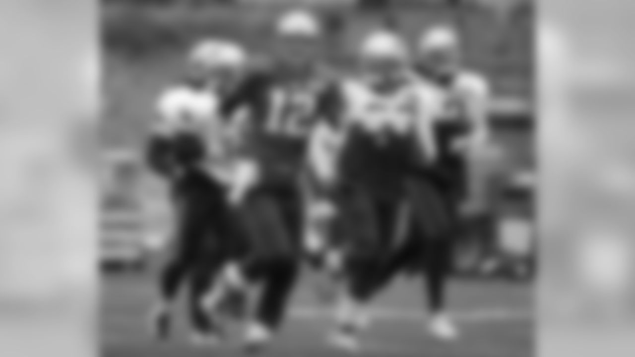 New England Patriots quarterback Tom Brady (12) warms up with teammates during an NFL football practice, Wednesday, Dec. 9, 2015, in Foxborough, Mass. The Patriots are to play the Houston Texans Sunday, Dec. 13, in Houston. (AP Photo/Steven Senne)