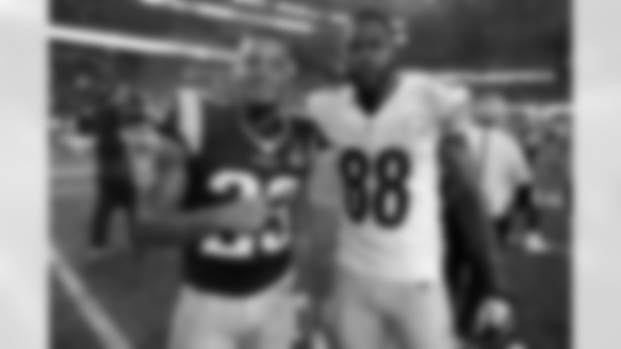New England Patriots strong safety Patrick Chung (23) and Pittsburgh Steelers wide receiver Darrius Heyward-Bey (88) pose for a photo post game at Gillette Stadium on Thursday, Sept. 10, 2015 in Foxborough, Mass. The Patriots won 28-21. (Ben Liebenberg via AP)